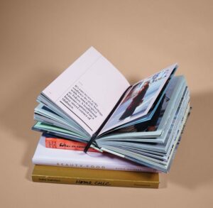 open book on top of several stacked books